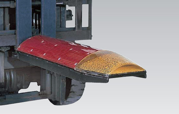 Coil Shoes for the transportation of sheet metal coils and wire coils. The coating prevents material damage and keeps the coils from slipping off.